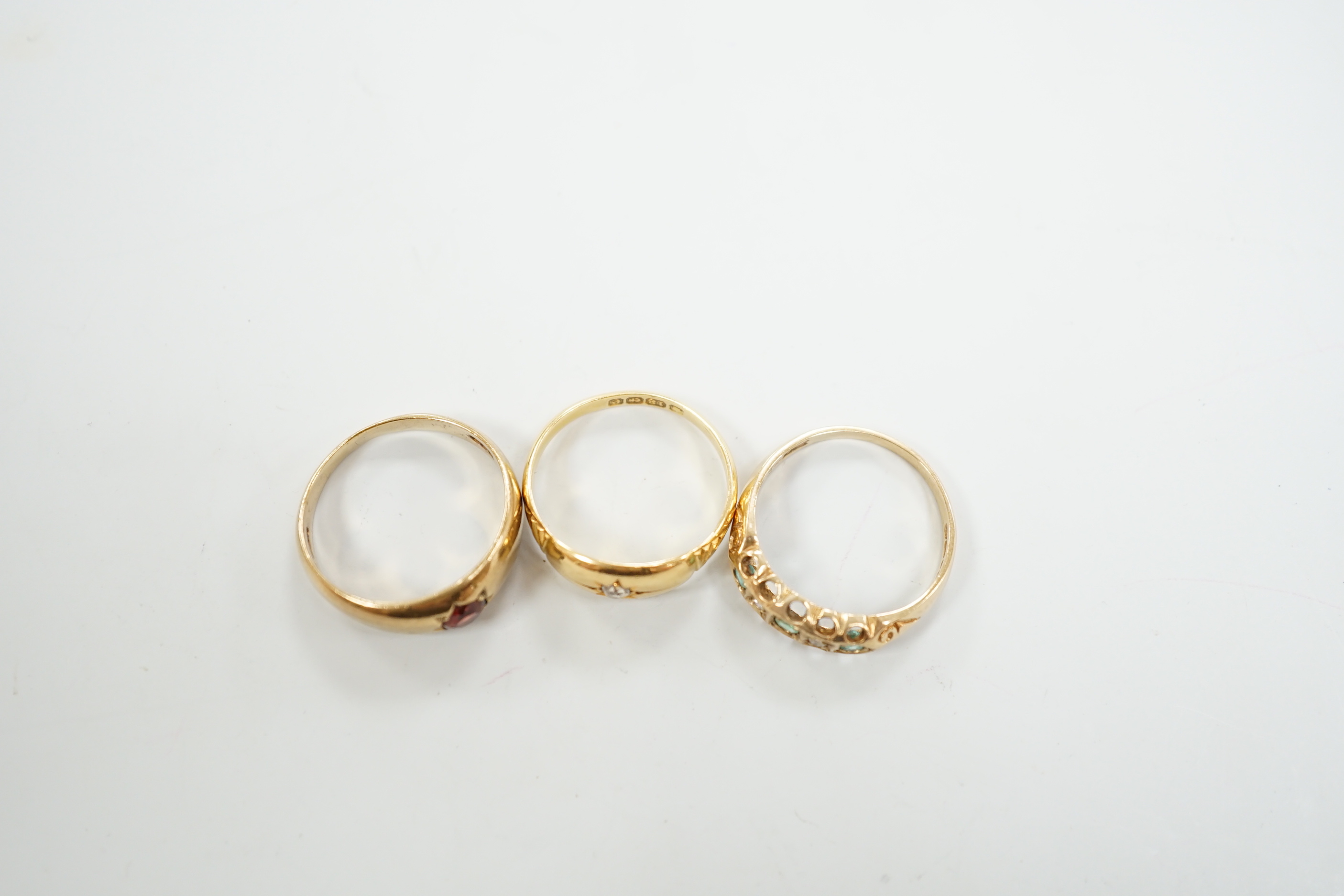 An Edwardian 18ct gold and diamond chip set ring, size M, gross weight 2.6 grams and two later 9ct gold and gem set rings, gross weight 5.5 grams.